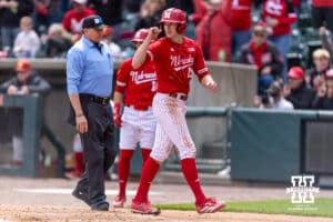 Nebraska Cornhusker Dylan Carey (15) gives a fist pump after scoring a run against the Southern California Trojans in the first inning during a college baseball game on Saturday, April 18, 2026, in Lincoln, Neb. Photo by John S. Peterson.