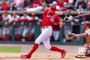 Nebraska Cornhusker Dylan Carey (15) hits a single in the first inning against the Southern California Trojans during a college baseball game on Saturday, April 18, 2026, in Lincoln, Neb. Photo by John S. Peterson.