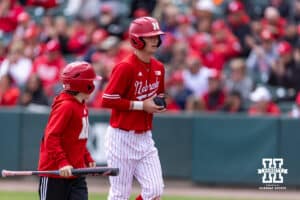 Nebraska Cornhusker Mac Moyer (17) jogs back to the dugout after scoring a run against the Southern California Trojans in the first inning during a college baseball game on Saturday, April 18, 2026, in Lincoln, Neb. Photo by John S. Peterson.