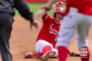 Nebraska Cornhusker Mac Moyer (17) slides to third base against the Southern California Trojans in the first inning during a college baseball game on Saturday, April 18, 2026, in Lincoln, Neb. Photo by John S. Peterson.