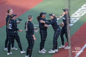 Omaha Softball Sammy Schmidt (17) celebrates with Bailey Sample (25) after her double play during a college softball game against South Dakota State on April 18, 2026, in Omaha, Nebraska. Photo by Brandon Tiedemann