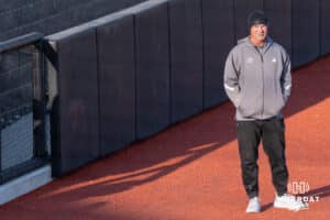 Omaha Softball head coach Mike Heard stands at third base during a college softball game against South Dakota State on April 18, 2026, in Omaha, Nebraska. Photo by Brandon Tiedemann