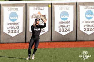 Omaha Softball Marra Cramer (9) catches a fly ball during a college softball game against South Dakota State on April 18, 2026, in Omaha, Nebraska. Photo by Brandon Tiedemann
