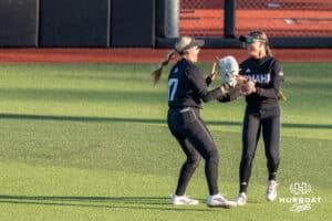 Omaha Softball Sammy Schmidt (17) celebrates her diving catch with teammates during a college softball game against South Dakota State on April 18, 2026, in Omaha, Nebraska. Photo by Brandon Tiedemann
