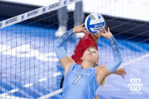 Creighton Bluejay setter Ivy Leuck (7) sets the ball against the Nebraska Cornhuskers in the third set during a college volleyball match on Friday, April 17, 2026, in Omaha, Neb. Photo by John S. Peterson.