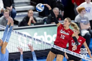 Nebraska Cornhusker middle blocker Andi Jackson (15) spikes the ball against the Creighton Bluejays in the second set during a college volleyball match on Friday, April 17, 2026, in Omaha, Neb. Photo by John S. Peterson.