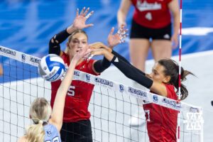 Nebraska Cornhusker outside hitter Harper Murray (27) hits the ball past Creighton Bluejay right side hitter Ashlyn Paymal (22) in the second set during a college volleyball match on Friday, April 17, 2026, in Omaha, Neb. Photo by John S. Peterson.