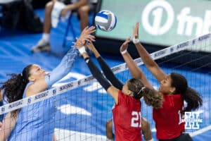 Creighton Bluejay Jaya Johnson (6) hits the ball against Nebraska Cornhuskers Skyler Pierce (21) and Manaia Ogbechie (14) in the second set during a college volleyball match on Friday, April 17, 2026, in Omaha, Neb. Photo by John S. Peterson.