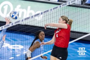 Nebraska Cornhusker setter Campbell Flynn (4) dumps the ball against the Creighton Bluejays in the second set during a college volleyball match on Friday, April 17, 2026, in Omaha, Neb. Photo by John S. Peterson.
