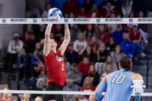 Nebraska Cornhusker setter Bergen Reilly (2) sets the ball against the Creighton Bluejays in the first set during a college volleyball match on Friday, April 17, 2026, in Omaha, Neb. Photo by John S. Peterson.