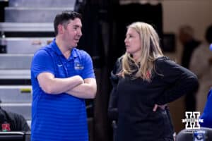 Creighton Bluejay head coach Brian Rosen and Nebraska Cornhusker head coach Dani Busboom Kelly meet before a college volleyball match on Friday, April 17, 2026, in Omaha, Neb. Photo by John S. Peterson.