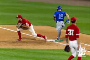 Nebraska Cornhusker infielder Case Sanderson (14) makes the out at first in the ninth inning against the Creighton Bluejay Nick Venteicher (12) during a college baseball game on Tuesday, April 14, 2026, in Lincoln, Neb. Photo by John S. Peterson.