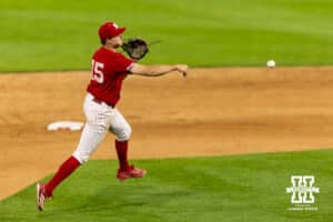 Nebraska Cornhusker infielder Dylan Carey (15) throws to first against the Creighton Bluejays in the ninth inning during a college baseball game on Tuesday, April 14, 2026, in Lincoln, Neb. Photo by John S. Peterson.