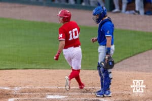 Nebraska Cornhusker Drew Grego (10) scores from Stokes' single in the third against the Creighton Bluejays during a college baseball game on Tuesday, April 14, 2026, in Lincoln, Neb. Photo by John S. Peterson.