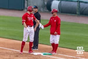 Nebraska Cornhusker infielder Josh Overbeek (4) hits a one-run single in the third against the Creighton Bluejays during a college baseball game on Tuesday, April 14, 2026, in Lincoln, Neb. Photo by John S. Peterson.