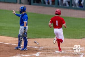 Nebraska Cornhusker Jett Buck (1) scores from an Overbeek single in the third against the Creighton Bluejays during a college baseball game on Tuesday, April 14, 2026, in Lincoln, Neb. Photo by John S. Peterson.