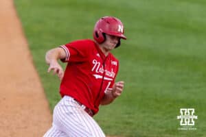 Nebraska Cornhusker Dylan Carey (15) rounds third to run home against the Creighton Bluejays in the third inning during a college baseball game on Tuesday, April 14, 2026, in Lincoln, Neb. Photo by John S. Peterson.