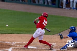 Nebraska Cornhusker Drew Grego (10) singles scoring Dylan Carey in the third against the Creighton Bluejays during a college baseball game on Tuesday, April 14, 2026, in Lincoln, Neb. Photo by John S. Peterson.