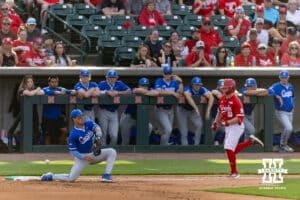 Nebraska Cornhusker Rhett Stokes (9) reaches first on a throwing error to Creighton Bluejay first baseman Chris Baillargeon (22) in the second inning during a college baseball game on Tuesday, April 14, 2026, in Lincoln, Neb. Photo by John S. Peterson.