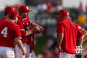 Nebraska Cornhuskers assistant coach Rob Childress makes a visit to the mound to talk with pitcher Pryce Bender (6) in the first inning during a college baseball game on Tuesday, April 14, 2026, in Lincoln, Neb. Photo by John S. Peterson.