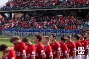 Creighton Bluejays and Nebraska Cornhuskers line up for the National Anthem during a college baseball game on Tuesday, April 14, 2026, in Lincoln, Neb. Photo by John S. Peterson.