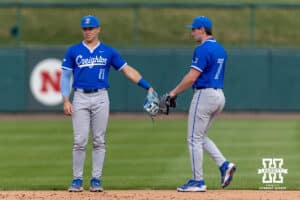 Creighton Bluejay infielders Ben North (11) and Jaxon Goldberg warming up before taking on the Nebraska Cornhuskers during a college baseball game on Tuesday, April 14, 2026, in Lincoln, Neb. Photo by John S. Peterson.
