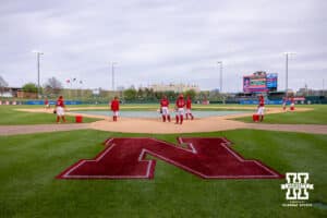 Nebraska Cornhuskers warms up before taking on the Creighton Bluejays during a college baseball game on Tuesday, April 14, 2026, in Lincoln, Neb.. Photo by John S. Peterson.