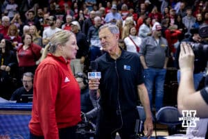 Former Nebraska head coach and now TV commentator John Cook interviews Nebraska head coach Dani Busboom Kelly after the win over the Iowa State Cyclones during a college volleyball match on Saturday, April 11, 2026, in Lincoln, Neb. Photo by John S. Peterson.