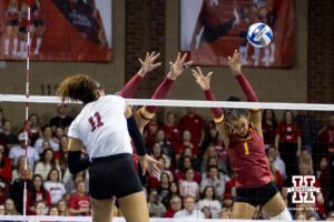Nebraska Cornhusker outside hitter Teraya Sigler (11) spikes the ball against Iowa State Cyclone middle blocker Pam McCune (1) in the fourth set during a college volleyball match on Saturday, April 11, 2026, in Lincoln, Neb. Photo by John S. Peterson.