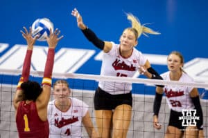 Nebraska Cornhusker middle blocker Andi Jackson (15) spikes the ball against Iowa State Cyclone middle blocker Pam McCune (1) in the fourth set during a college volleyball match on Saturday, April 11, 2026, in Lincoln, Neb. Photo by John S. Peterson.