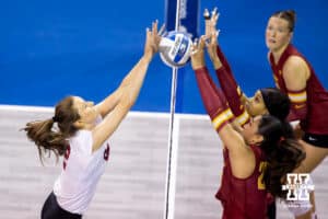Nebraska Cornhusker setter Bergen Reilly (2) takes on the Iowa State Cyclones at the net during a college volleyball match on Saturday, April 11, 2026, in Lincoln, Neb. Photo by John S. Peterson.