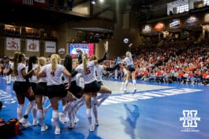 Nebraska Cornhuskers bench strikes a pose when Kenna Cogill serves the ball against the Iowa State Cyclones during a college volleyball match on Saturday, April 11, 2026, in Lincoln, Neb. Photo by John S. Peterson.