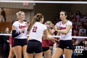 Nebraska Cornhusker opposite hitter Virginia Adriano (3) gives Bergen Reilly five after scoring a point during a college volleyball match on Saturday, April 11, 2026, in Lincoln, Neb. Photo by John S. Peterson.
