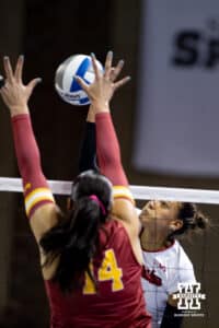 Nebraska Cornhusker outside hitter Harper Murray (27) spikes the ball against Iowa State Cyclone outside hitter Nayeli Gonzalez (14) during a college volleyball match on Saturday, April 11, 2026, in Lincoln, Neb. Photo by John S. Peterson.