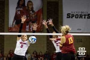 Nebraska Cornhusker middle blocker Kenna Cogill (8) blocks Iowa State Cyclone right side hitter Lilly Wachholz (13) during a college volleyball match on Saturday, April 11, 2026, in Lincoln, Neb. Photo by John S. Peterson.