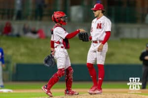 Nebraska Cornhusker catcher Jeter Worthley (0) brings the ball out to the mound to pitcher Grant Cleavinger (36) in the ninth inning against the Kansas Jayhawks during a college baseball game on Tuesday, April 7, 2026, in Lincoln. Photo by John S. Peterson.