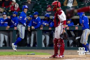 Kansas Jayhawk Cade Baldridge (9) celebrates two go ahead runs from him and Jordan Bach (31) during a college baseball game on Tuesday, April 7, 2026, in Lincoln. Photo by John S. Peterson.