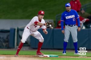 Nebraska Cornhusker infielder Case Sanderson (14) make an out at first against the Kansas Jayhawks in the seventh inning during a college baseball game on Tuesday, April 7, 2026, in Lincoln. Photo by John S. Peterson.