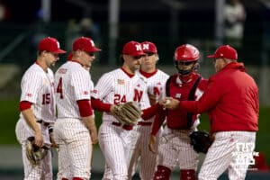 Nebraska Cornhusker pitching coach Rob Childress pulls pitcher Caleb Clark (24) to bringing in Kevin Mannell in the seventh inning against the Kansas Jayhawks during a college baseball game on Tuesday, April 7, 2026, in Lincoln. Photo by John S. Peterson.