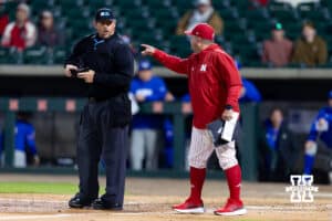 Nebraska Cornhusker head coach Will Bolt talks to the umpire about a call during a college baseball game against the Kansas Jayhawks on Tuesday, April 7, 2026, in Lincoln. Photo by John S. Peterson.