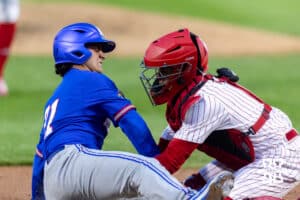 Nebraska Cornhusker catcher Jeter Worthley (0) tags Kansas Jayhawk Augusto Mungarrieta (21) out at home in the sixth inning during a college baseball game on Tuesday, April 7, 2026, in Lincoln. Photo by John S. Peterson.