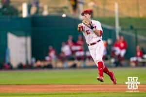 Nebraska Cornhusker infielder Dylan Carey (15) throws to first base against the Kansas Jayhawks during a college baseball game on Tuesday, April 7, 2026, in Lincoln. Photo by John S. Peterson.