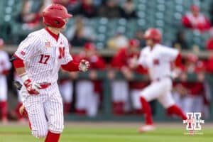 Nebraska Cornhusker Mac Moyer (17) singles in the second, scoring two runs against the Kansas Jayhawks during a college baseball game on Tuesday, April 7, 2026, in Lincoln. Photo by John S. Peterson.