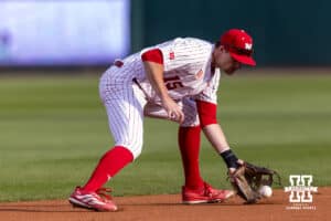 Nebraska Cornhusker infielder Dylan Carey (15) scoops up the ball to throw to second for a out against the Kansas Jayhawks in the first inning during a college baseball game on Tuesday, April 7, 2026, in Lincoln. Photo by John S. Peterson.