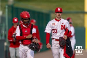 Nebraska Cornhusker pitcher Gavin Blachowicz (50) and catcher Jeter Worthley (0) head to the dugout to start the game against the Kansas Jayhawks during a college baseball game on Tuesday, April 7, 2026, in Lincoln. Photo by John S. Peterson.