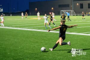 Gretna East’s Izzie Kahm (14) passes the ball against Pius during a high school girls soccer game Monday, March 30, 2026, in Gretna, Nebraska. Photo by Jackson D. Luethje.