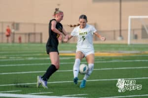 Gretna East’s Ellie Leahy (310 guarded by Pius' Kenzie Nickolite (5) during a high school girls soccer game Monday, March 30, 2026, in Gretna, Nebraska. Photo by Jackson D. Luethje.