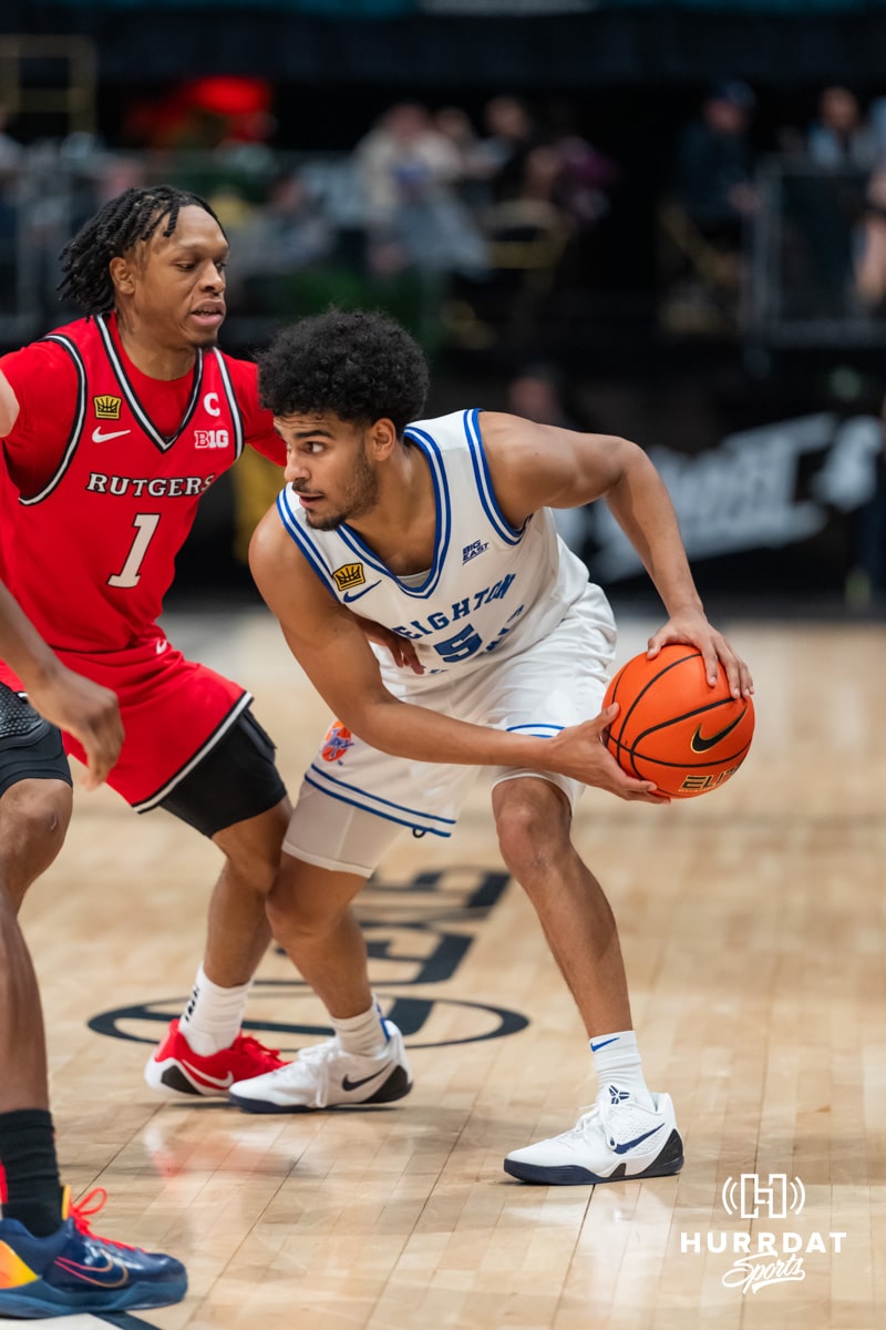 Creighton Bluejay guard Nik Graves (5) dribbles the ball against Rutgers Scarlet Knight guard Jamichael Davis (1) during the first round of the Crown tournament on Thursday, April 2, 2026, in Las Vegas, Nevada. Photo by Cole Curtis.