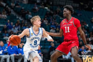 Creighton Bluejay guard Ty Davis (9) dribbles the ball against Rutgers Scarlet Knight forward Christopher Nwuli (11) during the first round of the Crown tournament on Thursday, April 2, 2026, in Las Vegas, Nevada. Photo by Cole Curtis.