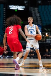 Creighton Bluejay guard Ty Davis (9) dribbles the ball against Rutgers Scarlet Knight guard Lino Mark (2) during the first round of the Crown tournament on Thursday, April 2, 2026, in Las Vegas, Nevada. Photo by Cole Curtis.